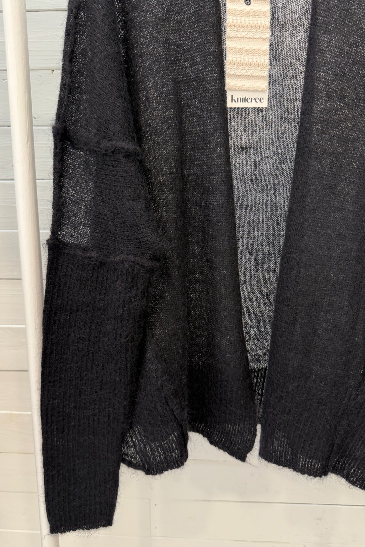 Cardigan aperto velato