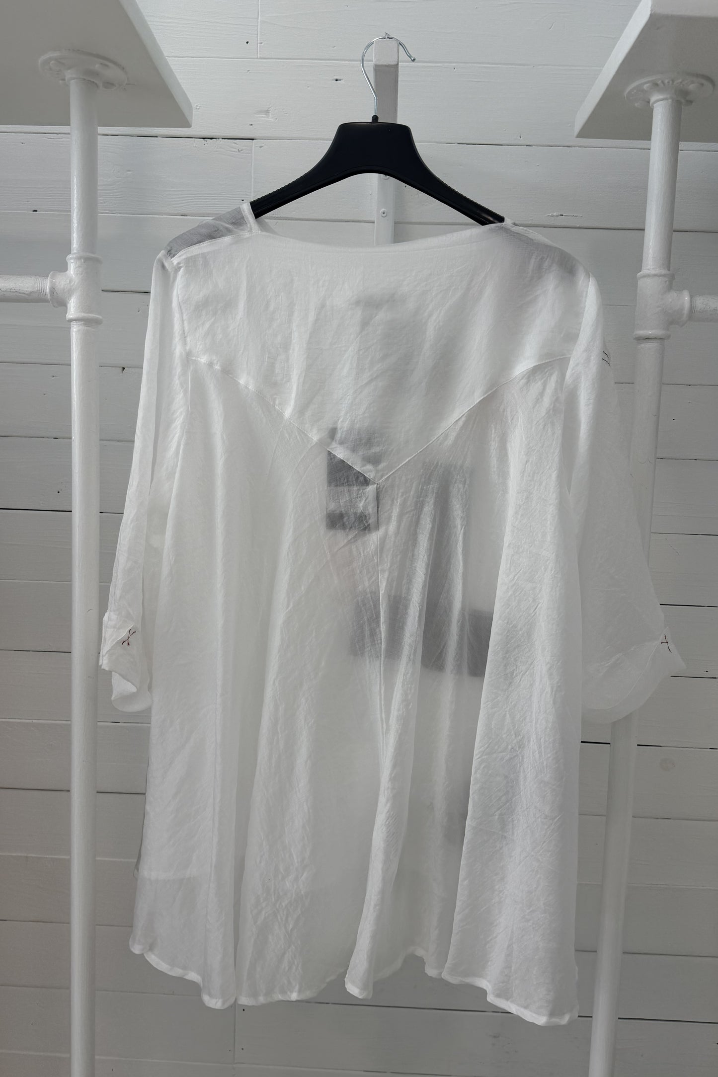 Blusa con applicazioni artistiche circolari