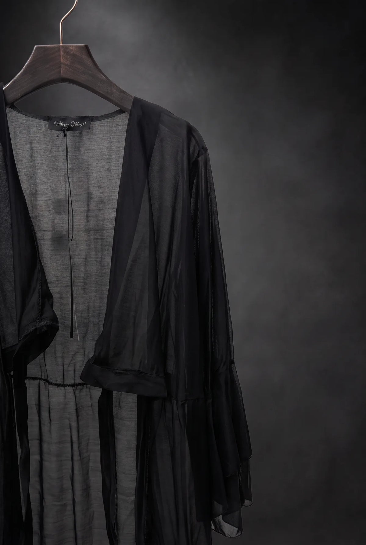Camicia lunga trasparente con volant