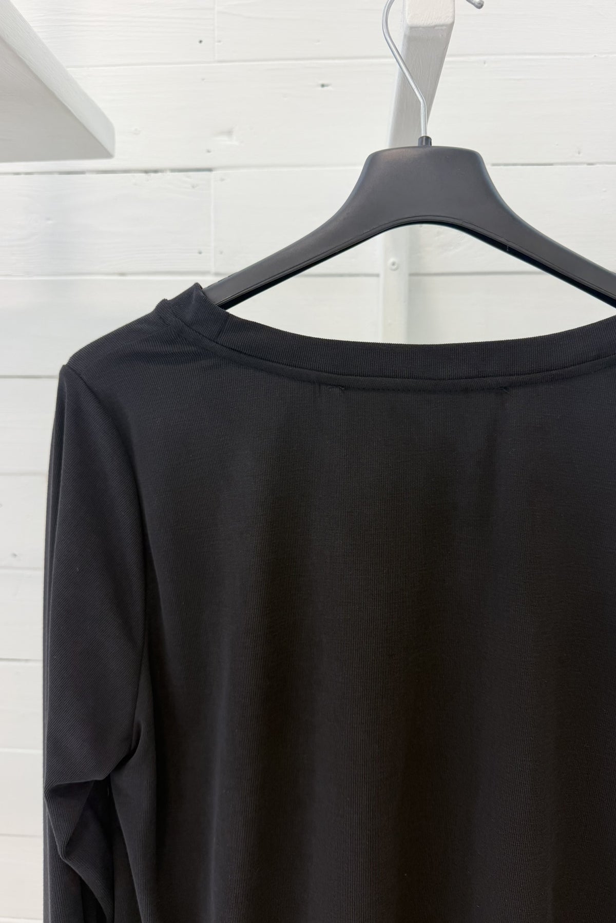 Maglia lunga con fondo asimmetrico