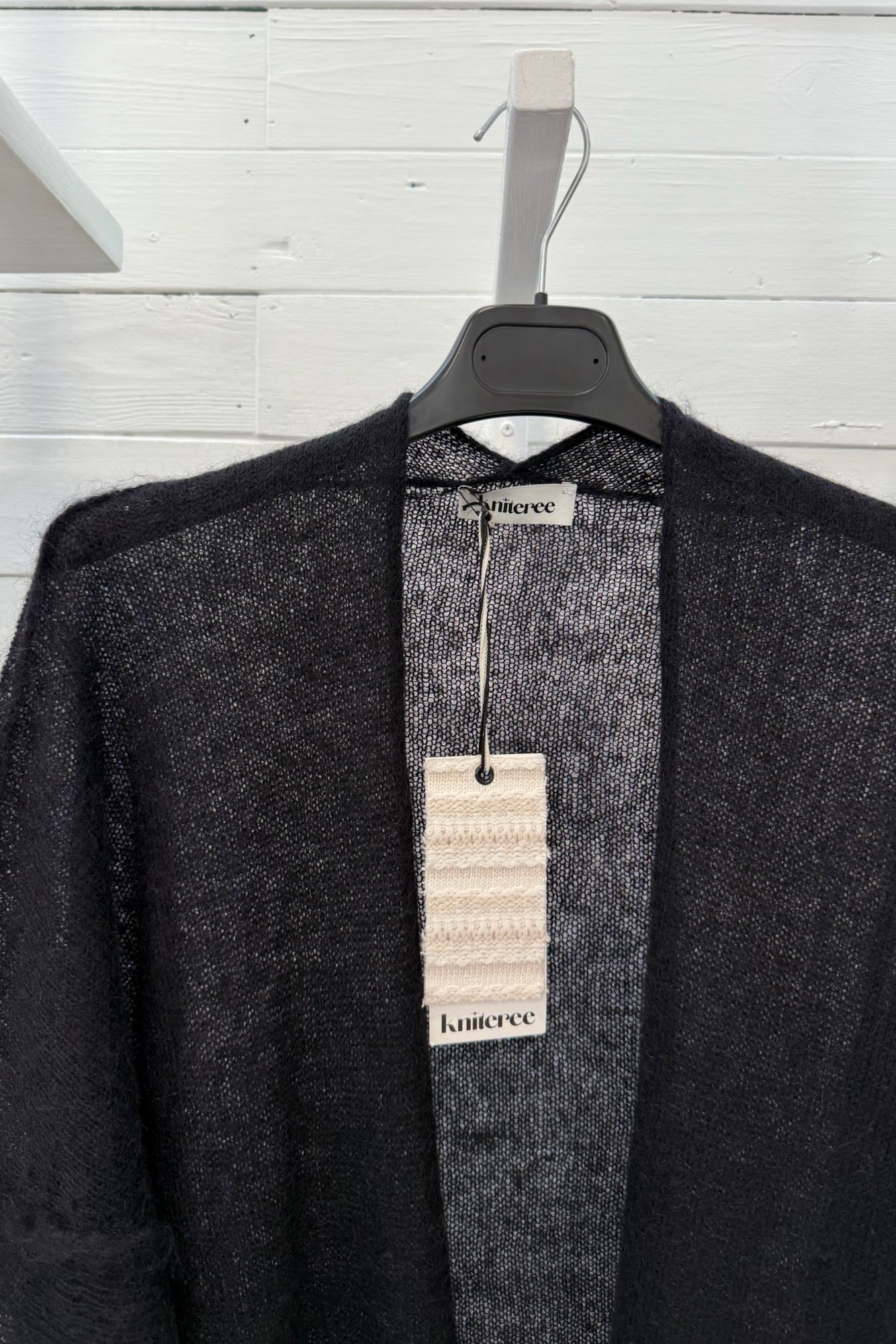 Cardigan aperto velato