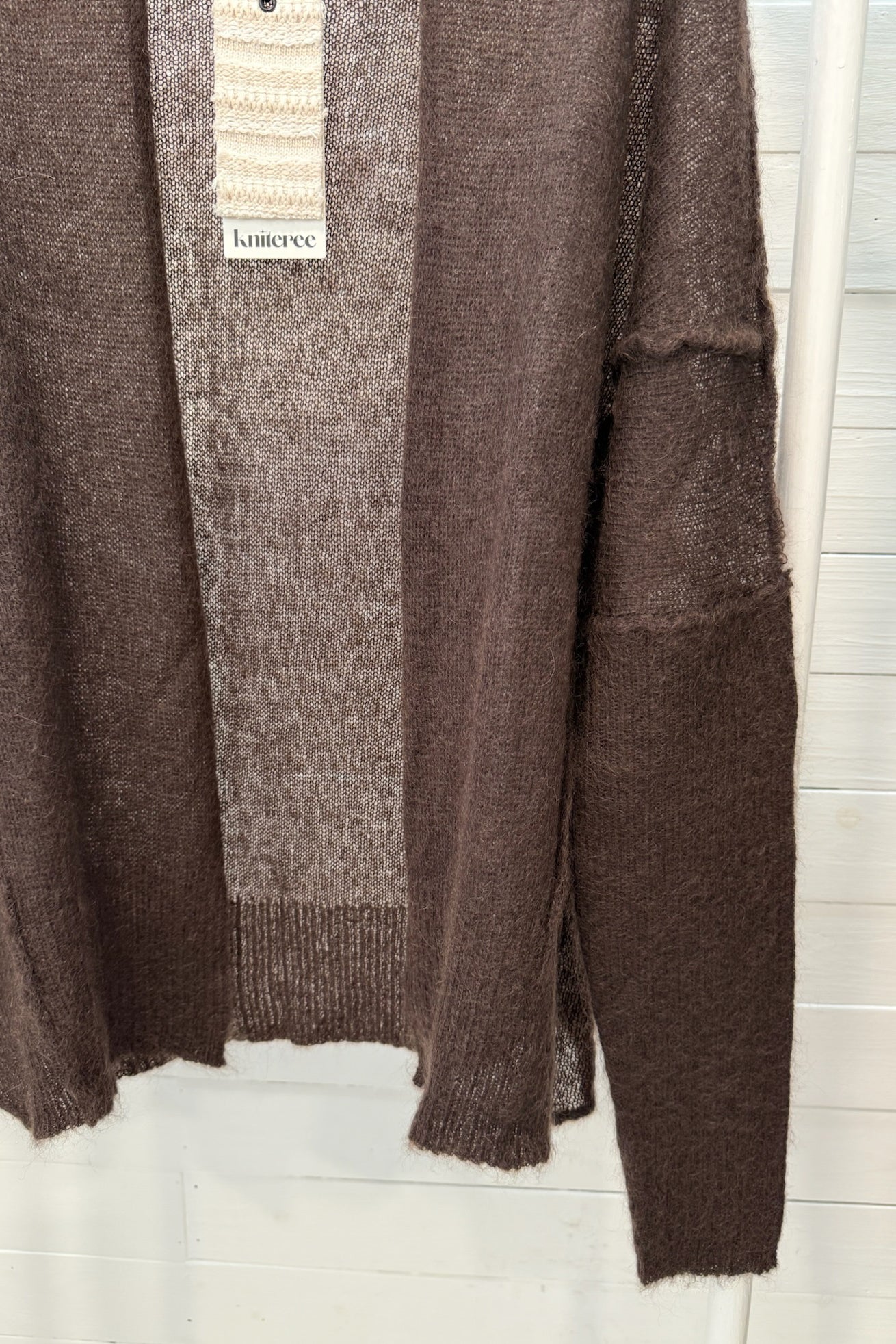 Cardigan aperto velato