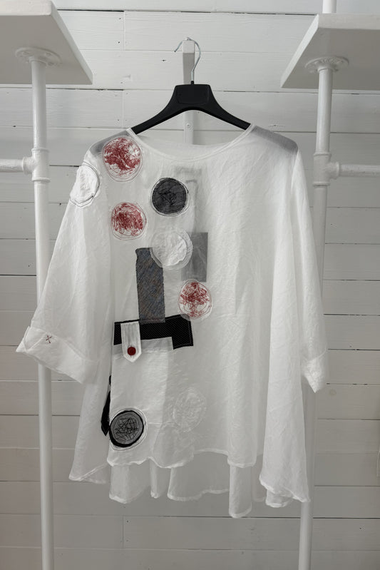 Blusa con applicazioni artistiche circolari