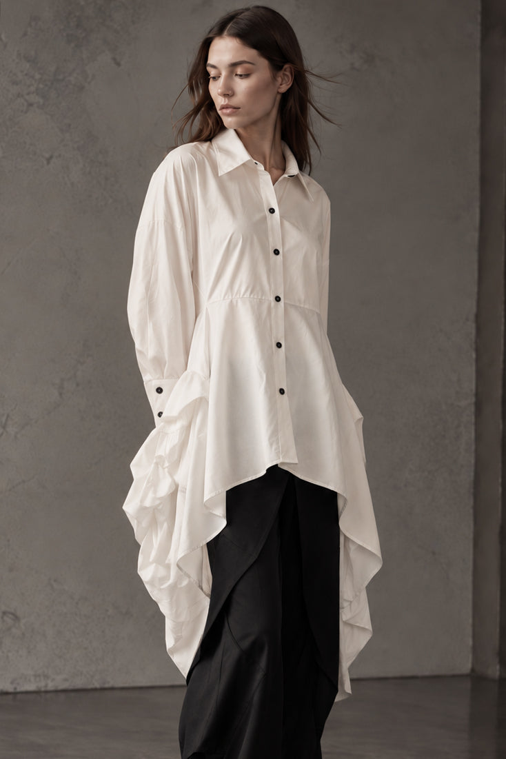 Camicia lunga asimmetrica con fondo drappeggiato