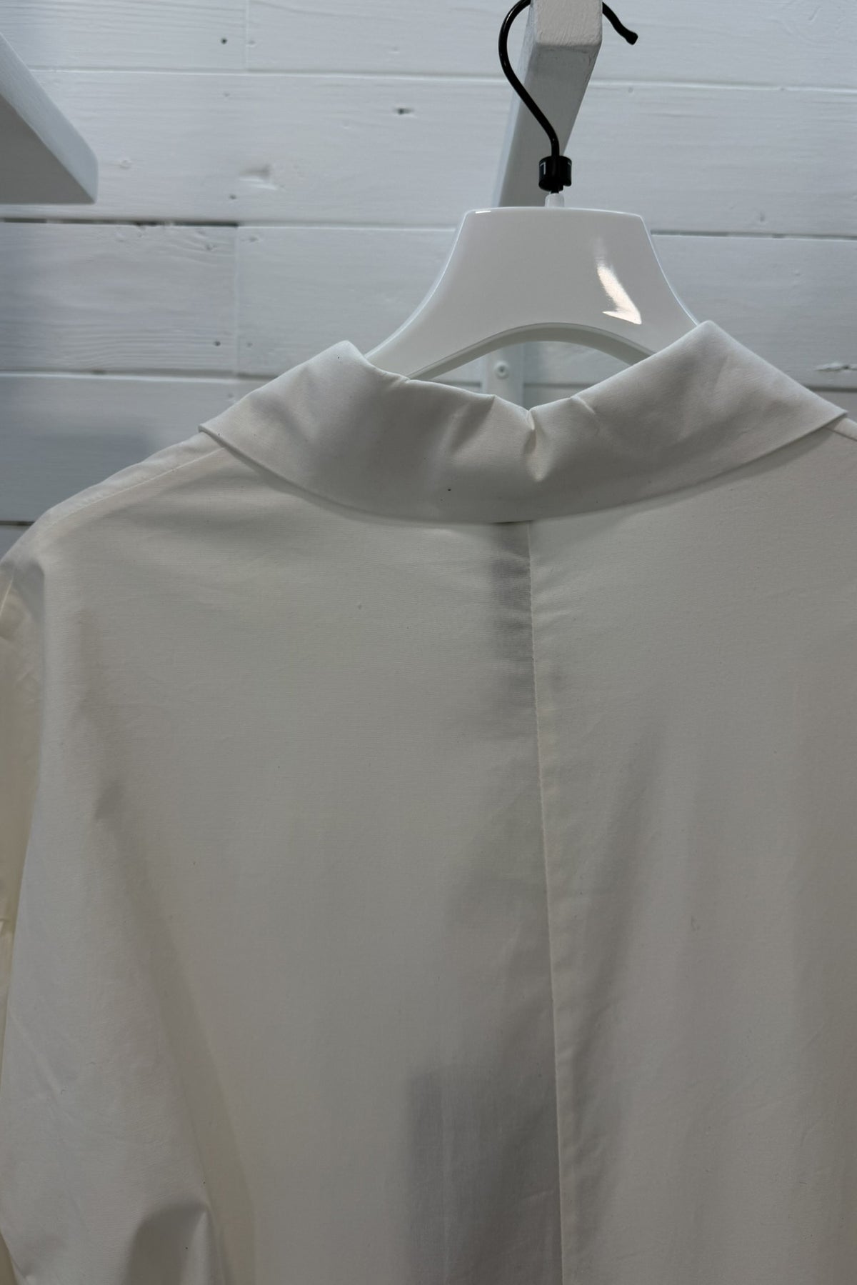 Camicia lunga asimmetrica con fondo drappeggiato