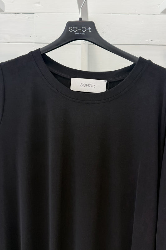 Maglia lunga con fondo asimmetrico