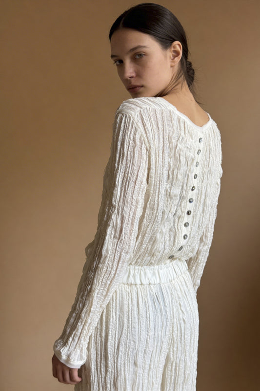 Blusa con bottoni madreperla