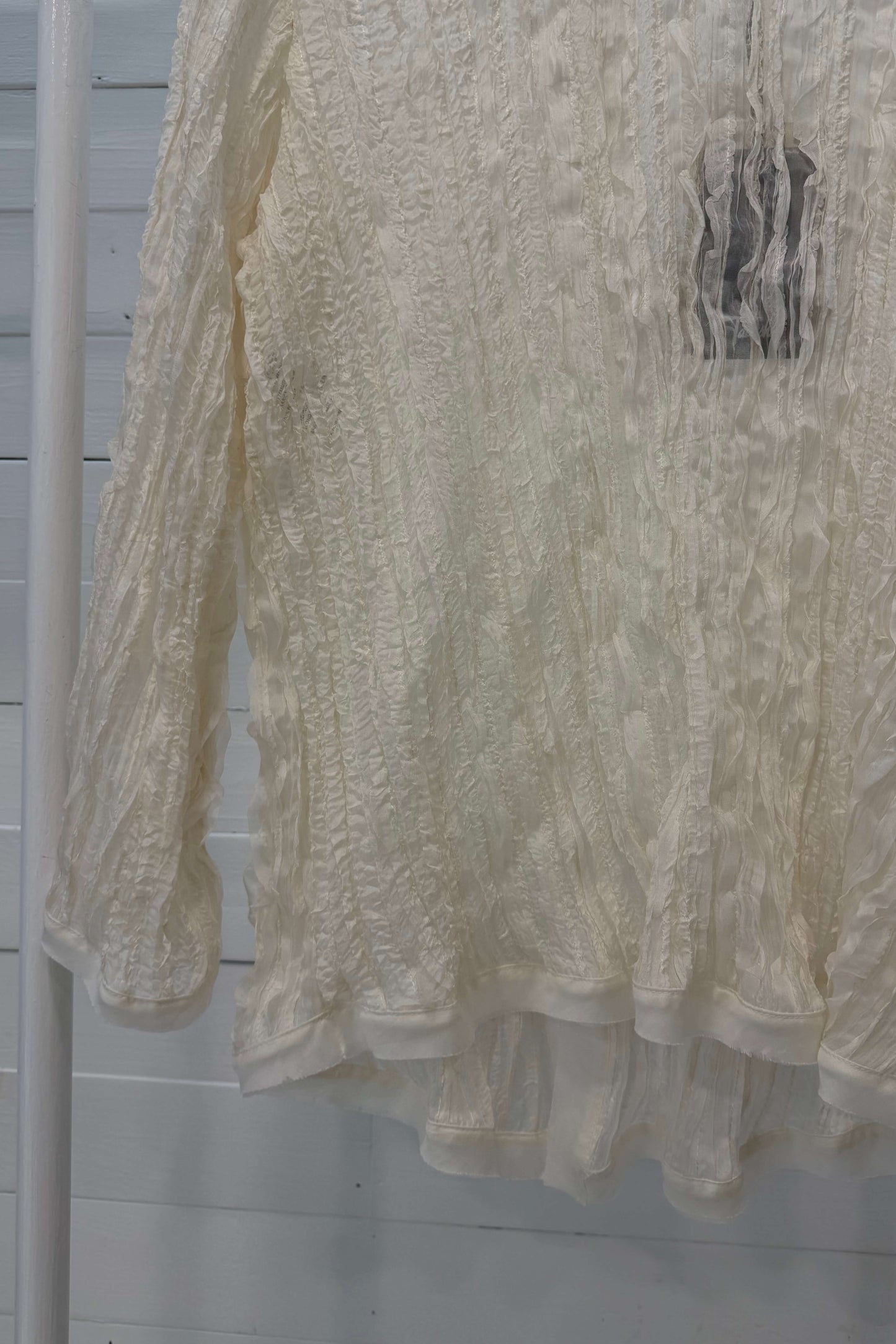 Blusa con bottoni madreperla