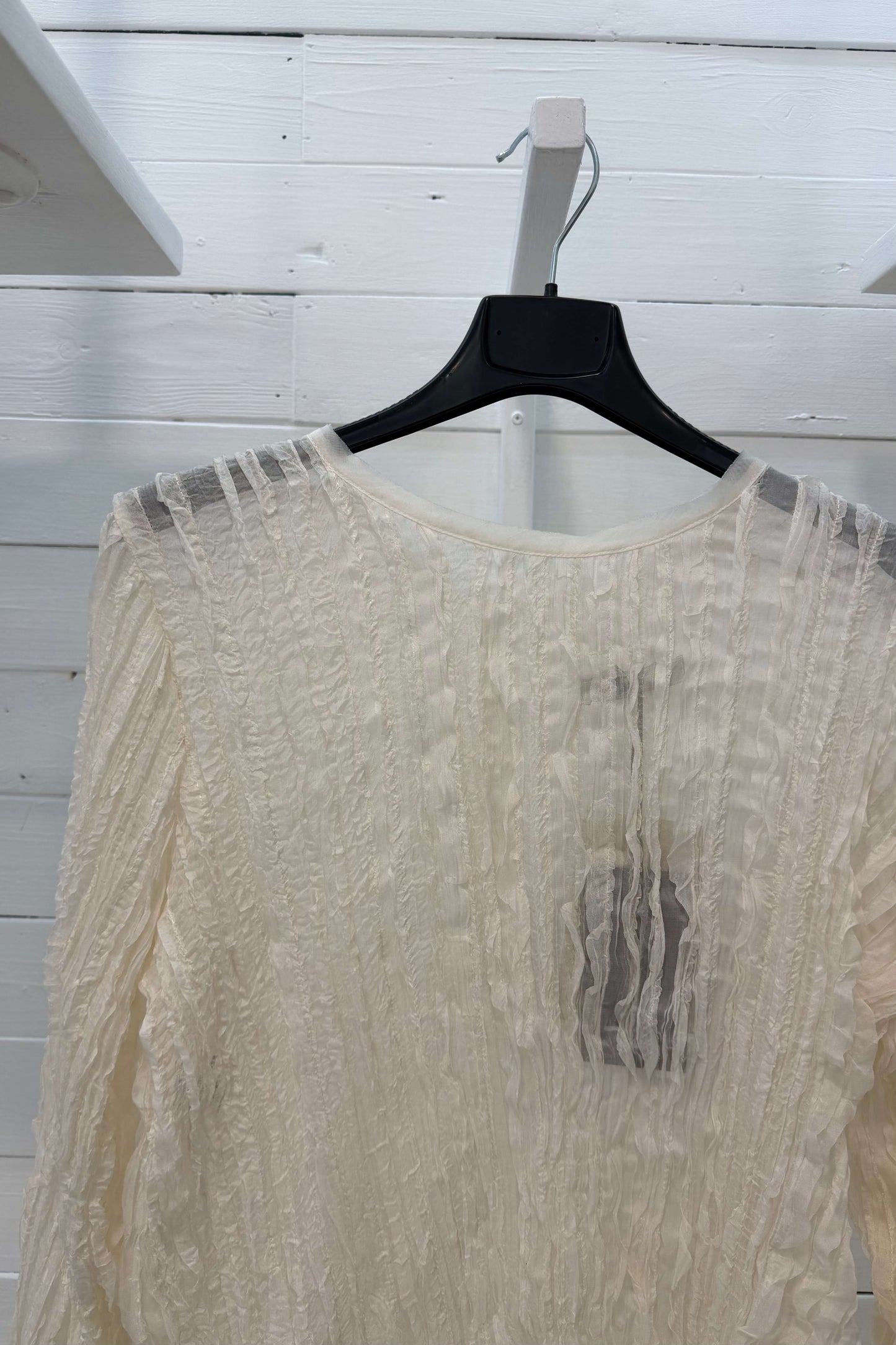 Blusa con bottoni madreperla